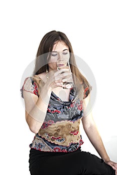 Young Woman with Beautiful Green Eyes Drinking Glass of Water