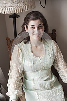 Young Woman with Beautiful Green Eyes in Vintage Dress