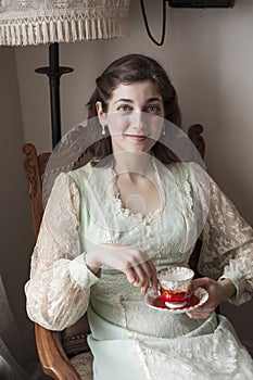 Young Woman with Beautiful Green Eyes in Vintage Dress