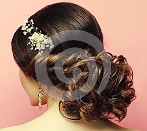 young woman with beautiful hairstyle and stylish hair accessory