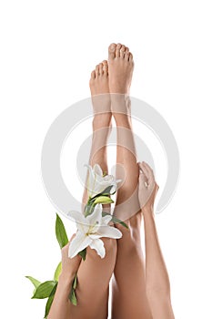 Young woman with beautiful long legs on white background