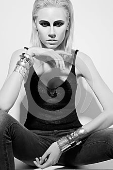 young woman with beauty hairsyle sitting on the floor