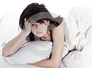 Young woman in bed awakening tired insomnia hangover