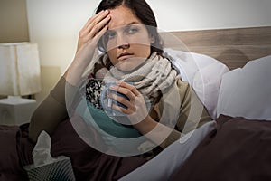 Young woman in bed having flu