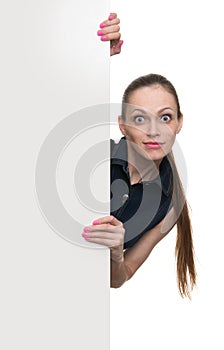 Young woman behind blank white board