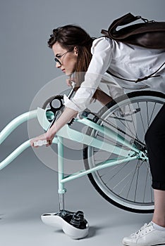 Young woman with bicycle