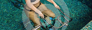 Young woman on bicycle simulator underwater in the pool BANNER, long format