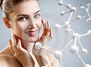 Young woman with big glass molecule chain.