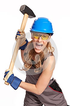 Young woman with a big hammer