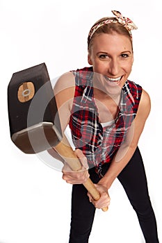 Young woman with a big hammer