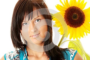 Young woman with a big sun flower