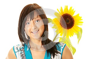 Young woman with a big sun flower