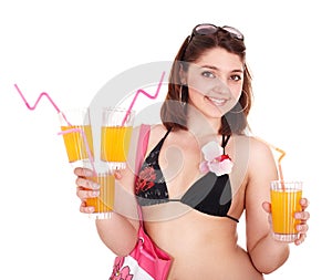 Young woman in bikini with coctail.