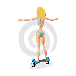 Young woman in a bikini is riding a gyroscope