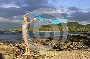 Young woman in bikini standing at Las Galeras beach, Samana peninsula photo