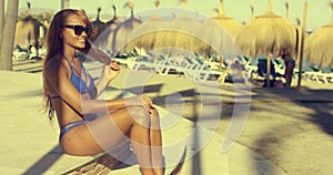 young woman in a bikini at the waterfront