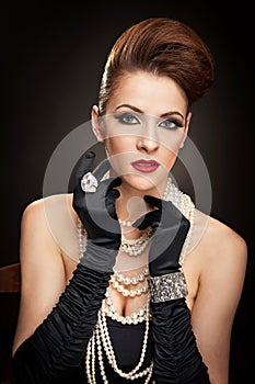 Young woman in black dress and gloves