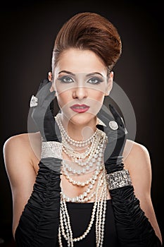 Young woman in black dress and gloves