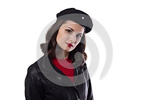 Young woman black jacket, red sweater and hat with a reference to Ernesto Che Guevara looking in camera photo