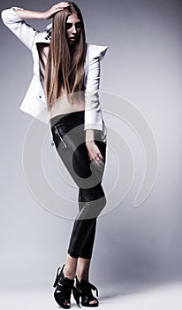Young woman in black leggings. Glamour, beauty