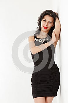 Young woman in black mini dress
