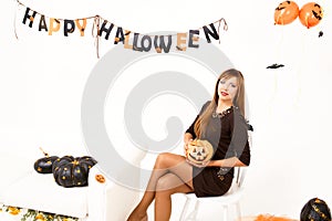 Young woman with black pumking