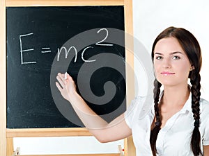 Young woman & blackboard