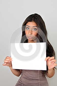 Young woman and blank sign.