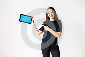 Young woman with a blank tablet isolated on white
