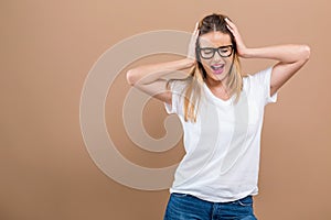 Young woman blocking her ears