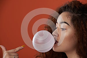 Young woman blow bubble gum blow