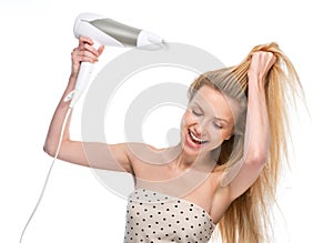 Young woman blow-dry