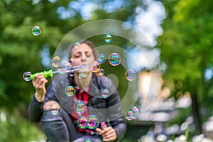 Young Woman Blowing Bubbles