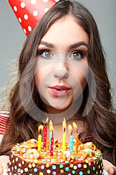 Woman blowing out candles