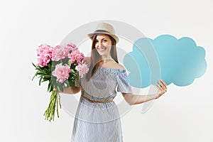 Young woman in blue dress, hat holding blank empty say cloud, speech bubble with place text, bouquet of pink peonies