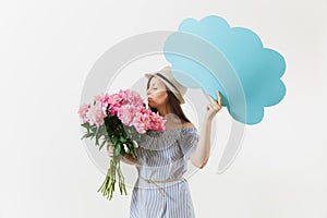 Young woman in blue dress, hat holding blank empty say cloud, speech bubble with place text, bouquet of pink peonies