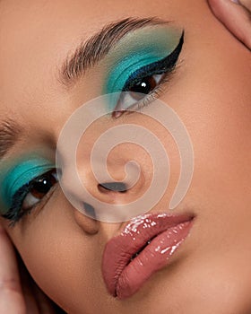 young woman with blue eye shadow makeup