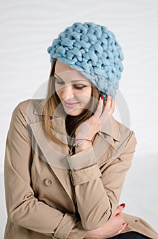 Young woman in blue fashionable merino hat
