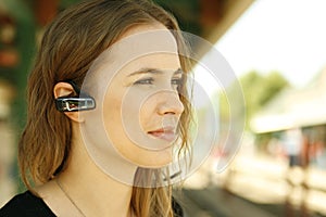 Young woman bluetooth headset