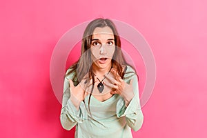 Young woman with blunder expression, isolated on background