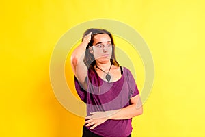 Young woman with blunder expression, isolated on background