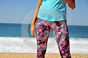 Young woman body with deep blue sea on background