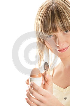 Young woman with boiled egg
