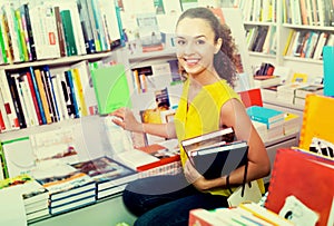 Young woman in book shop