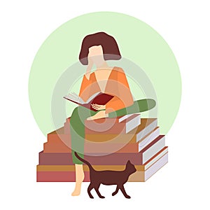 Young woman with book sitting on  stack of books with cat. photo