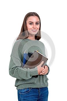 Young woman with books smiling, isolated over white background