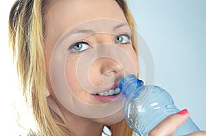 Young woman with bottle of water