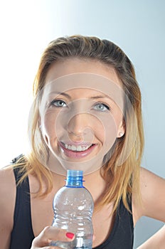 Young woman with bottle of water