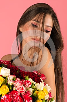 Young woman with bouquet roses closeup