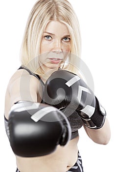 Young woman in boxing gloves. Decisiveness and courage. Isolated over white background. photo